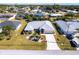 Aerial view of single-story house with yard at 72 Norman St, Port Charlotte, FL 33954