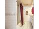 Bathroom with shower, tub, and maroon curtain at 72 Norman St, Port Charlotte, FL 33954