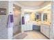Elegant bathroom with dual sinks and a walk-in shower at 72 Norman St, Port Charlotte, FL 33954