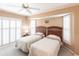 Bedroom with two twin beds and window shutters at 72 Norman St, Port Charlotte, FL 33954
