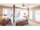 Main bedroom with four-poster canopy bed and access to patio doors at 72 Norman St, Port Charlotte, FL 33954