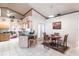 Bright dining area with wood table and chairs, adjacent to the kitchen at 72 Norman St, Port Charlotte, FL 33954