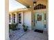 Inviting entryway with light green door and tiled flooring at 72 Norman St, Port Charlotte, FL 33954