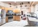 Modern kitchen with stainless steel appliances and granite countertops at 72 Norman St, Port Charlotte, FL 33954