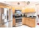 Kitchen with stainless steel appliances and wood cabinets at 72 Norman St, Port Charlotte, FL 33954