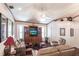 Bright living room with hardwood floors, comfy furniture, and built-in shelving at 72 Norman St, Port Charlotte, FL 33954