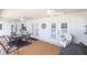 Covered patio with outdoor furniture and access to the pool at 72 Norman St, Port Charlotte, FL 33954