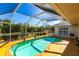 Inviting kidney-shaped pool with a screened enclosure at 72 Norman St, Port Charlotte, FL 33954