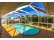 Inviting kidney-shaped pool with screened enclosure at 72 Norman St, Port Charlotte, FL 33954