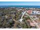 Aerial view showing home's location near the water at 728 Wood St, Dunedin, FL 34698