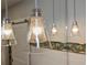Stylish glass pendant lights above bathroom vanity at 728 Wood St, Dunedin, FL 34698