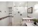 Modern bathroom with a glass shower enclosure and mosaic tile accents at 728 Wood St, Dunedin, FL 34698