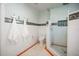 Modern bathroom featuring a toilet and a glass-enclosed shower at 728 Wood St, Dunedin, FL 34698