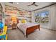 Charming bedroom with wood-paneled accent wall at 728 Wood St, Dunedin, FL 34698