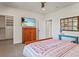 Main bedroom with large closet and TV at 728 Wood St, Dunedin, FL 34698