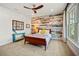 Bedroom with wood-paneled accent wall at 728 Wood St, Dunedin, FL 34698