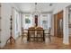 Elegant dining room featuring a large table and chandelier at 728 Wood St, Dunedin, FL 34698