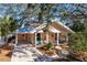 Charming two-story home with a metal roof and landscaped yard at 728 Wood St, Dunedin, FL 34698