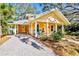 Quaint house exterior with a welcoming front porch at 728 Wood St, Dunedin, FL 34698