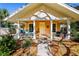 Charming house with a welcoming front porch and landscaping at 728 Wood St, Dunedin, FL 34698