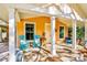 Inviting front porch with rocking chairs and a view at 728 Wood St, Dunedin, FL 34698