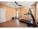 Bright home gym with hardwood floors, treadmill and other workout equipment at 728 Wood St, Dunedin, FL 34698