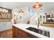 Modern kitchen with a large island and stainless steel appliances at 728 Wood St, Dunedin, FL 34698