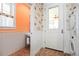 Laundry room with washer, dryer, and stylish fish-themed wallpaper at 728 Wood St, Dunedin, FL 34698