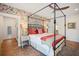Main bedroom with king-size bed and floral wallpaper at 728 Wood St, Dunedin, FL 34698
