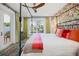 Spacious main bedroom with king-size bed and access to backyard at 728 Wood St, Dunedin, FL 34698