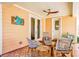 Relaxing patio with wicker furniture and colorful tile floor at 728 Wood St, Dunedin, FL 34698