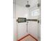 Walk-in shower with a rain shower head and mosaic tile details at 728 Wood St, Dunedin, FL 34698