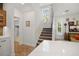 Modern staircase with light wood railing and carpet at 728 Wood St, Dunedin, FL 34698