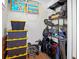 Well-organized storage room with shelving and space for luggage and bikes at 728 Wood St, Dunedin, FL 34698