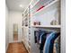 Large walk-in closet with ample shelving and hanging space at 728 Wood St, Dunedin, FL 34698