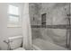 Bathroom with shower/tub combo and updated tile at 735 Bonnie Blvd, Palm Harbor, FL 34684