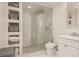 Modern bathroom with walk-in shower and built-in shelving at 735 Bonnie Blvd, Palm Harbor, FL 34684