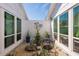 Private courtyard with seating area, perfect for relaxing and enjoying the outdoors at 735 Bonnie Blvd, Palm Harbor, FL 34684