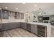 Open concept kitchen with stainless steel appliances and a wine cooler at 735 Bonnie Blvd, Palm Harbor, FL 34684