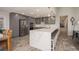 Updated kitchen boasts stainless steel appliances and a large island with seating at 735 Bonnie Blvd, Palm Harbor, FL 34684