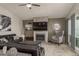 Cozy living room with a fireplace and large screen TV at 735 Bonnie Blvd, Palm Harbor, FL 34684