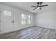 Spacious living room with hardwood floors and large windows at 9750 68Th N St, Pinellas Park, FL 33782