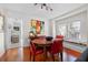 Charming dining room with hardwood floors, window seat, and round table at 1001 13Th N St, St Petersburg, FL 33705