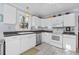 White kitchen with stainless steel appliances at 1001 13Th N St, St Petersburg, FL 33705