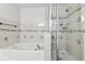 Bathroom with soaking tub and walk-in shower at 10739 Bamboo Rod Cir, Riverview, FL 33569