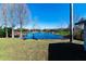 Serene backyard view overlooking a peaceful lake at 11416 Pine Forest Dr, New Port Richey, FL 34654