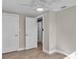 Spacious bedroom with hardwood floors and access to other rooms at 11416 Pine Forest Dr, New Port Richey, FL 34654