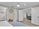 Bright bedroom with a king-size bed and access to living room at 11416 Pine Forest Dr, New Port Richey, FL 34654