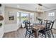 Spacious dining room with a bay window and wooden table at 11416 Pine Forest Dr, New Port Richey, FL 34654