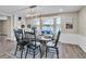 Charming dining room with a farmhouse table and lake view at 11416 Pine Forest Dr, New Port Richey, FL 34654